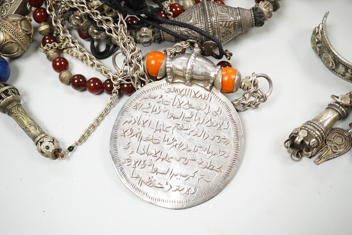 A collection of Bedouin white metal, gilt metal, lapis lazuli mounted jewellery, etc. from Oman